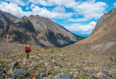 heavy-climb-mountains-with-backpack-travel-lifestyle-hiking-hard-track-adventure-concept-summer-vacation_158388-7099