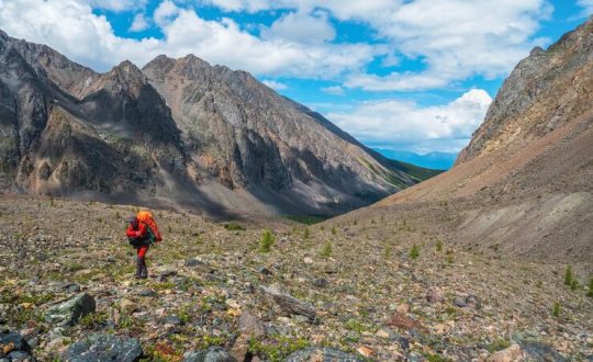 heavy-climb-mountains-with-backpack-travel-lifestyle-hiking-hard-track-adventure-concept-summer-vacation_158388-7099