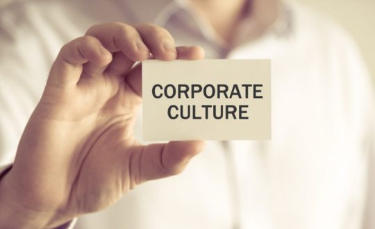 Businessman Holding Corporate Culture Message Card